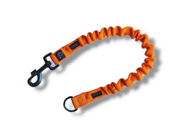 orange shock absorber for a handicraft dog